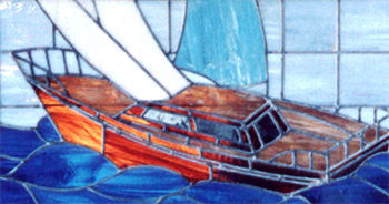 Closeup of large custom stained and leaded glass sailboat window