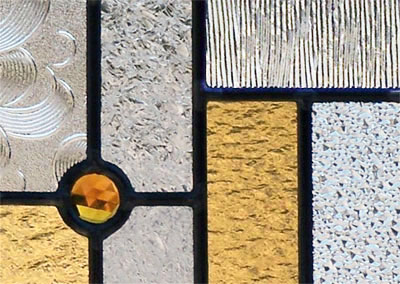 Closeup of stained and leaded glass abstract window