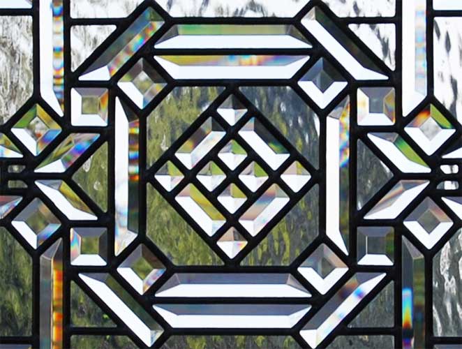 Closeup of custom leaded glass abstract pencil bevel window