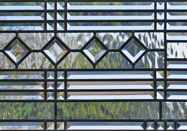 Closeup of custom leaded glass abstract transom window